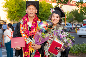 photo of two SCC graduates at commencement ceremony