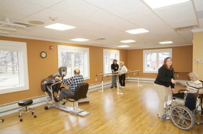 physical therapy professionals and patients working in an exercise space
