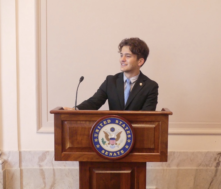 Alec Sarkissian speaking at a US Senate podium