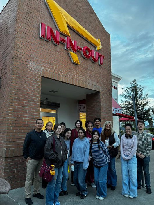 group photo of Honors Club members in front of a burger restaurant
