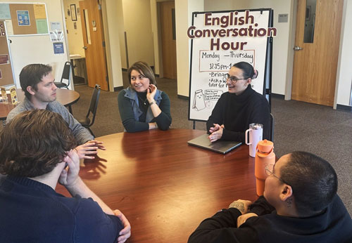 students engaged in the Writing Center Conversation Hour