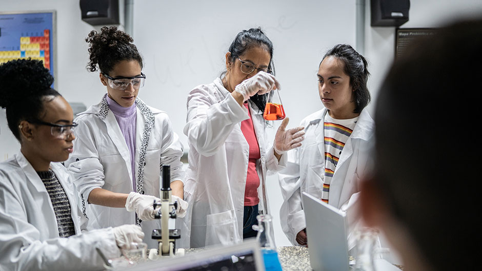 Chemistry students and professor in the lab