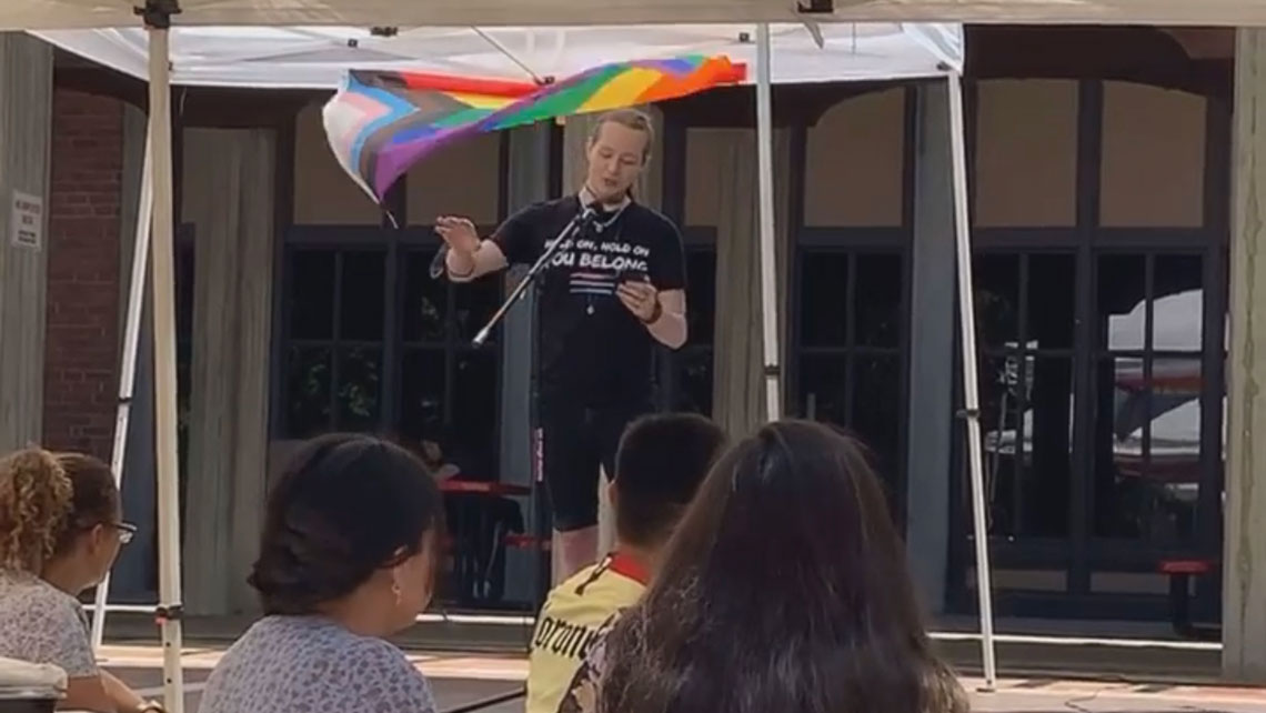 Open Mic Event with performer on stage and audience