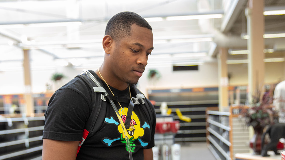 NextUP student purchasing supplies at the college store