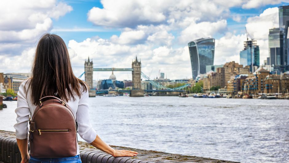 London, England girl looking at city during a cloudy day